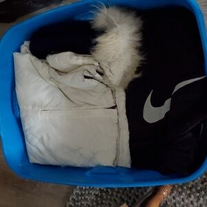 Tup of winter coats and ski pants